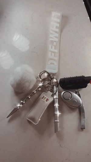
            
                Load and play video in Gallery viewer, White Off-White Safety Wristlet
            
        